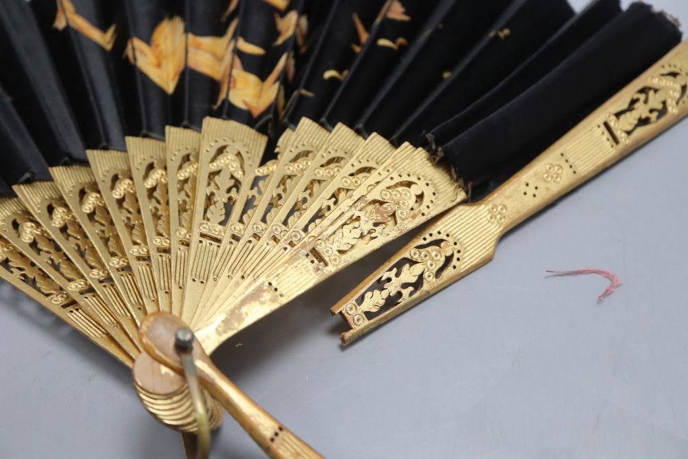 An 18th century circular framed embroidery, worked with chenille and pearls, a brise fan, two other fans, a 1930s sequin collar and an